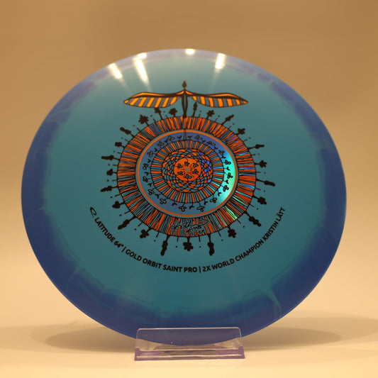 Latitude 64 Saint Pro Gold Orbit Kristin Latt Team Series Baby Blue Blue Multi 173g - Laredo Disc Golf Store