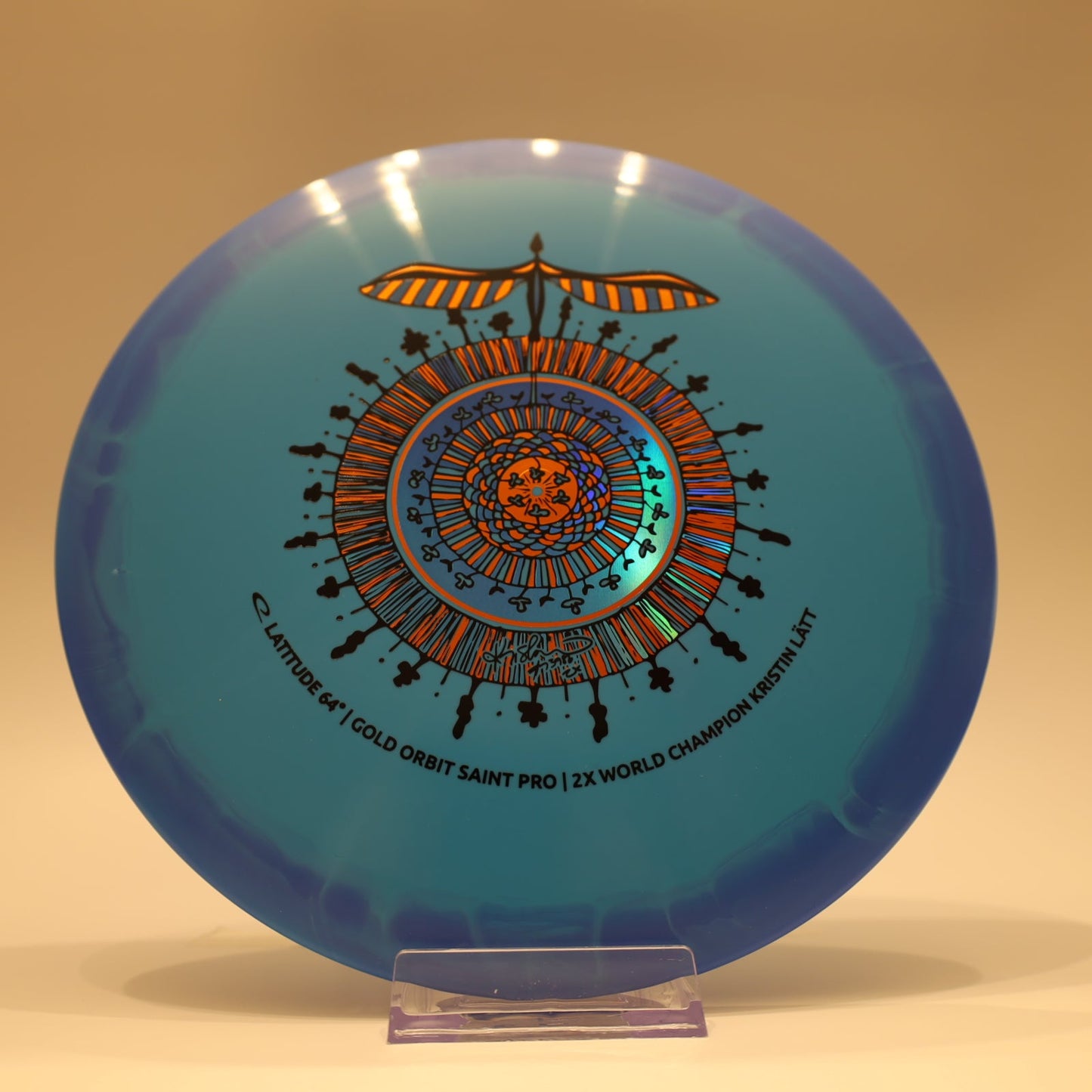 Latitude 64 Saint Pro Gold Orbit Kristin Latt Team Series Baby Blue Blue Multi 174g - Laredo Disc Golf Store