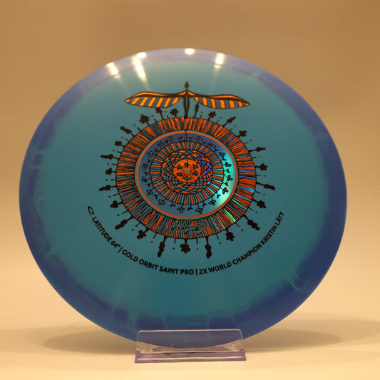 Latitude 64 Saint Pro Gold Orbit Kristin Latt Team Series Baby Blue Blue Multi 174g - Laredo Disc Golf Store